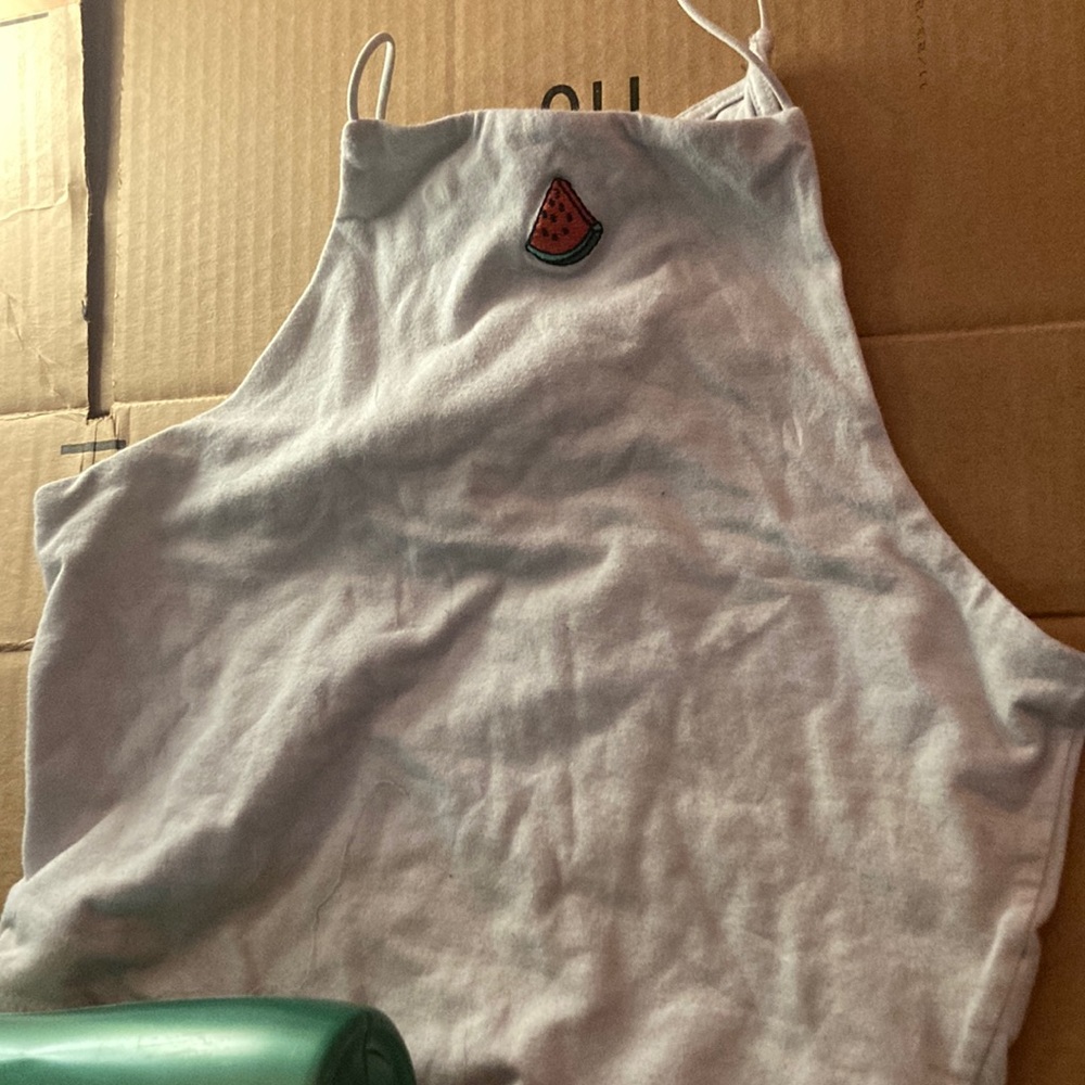 This is a crop top. It’s white. It’s been worn but only a few times. Medium.